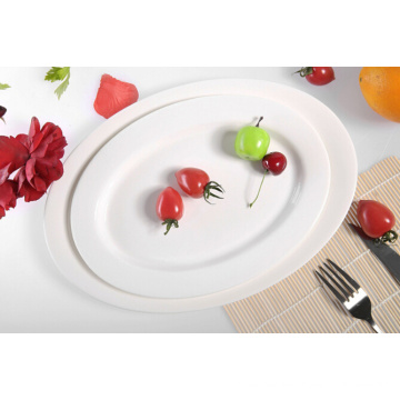Haonai hotel dinner plate white porcelain/ceramic dinner plate oval shape flat plate for dinning,party